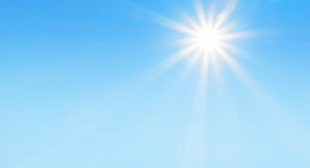 Bright sun with beautiful beams in a blue sky Bright sun with beautiful beams in a blue sky. Space for copy. sunny stock pictures, royalty-free photos & images