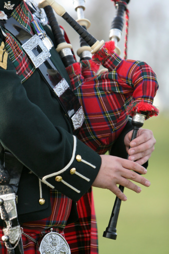 Wonderful rich colours of tartan worn by the Scottish Bag Piper