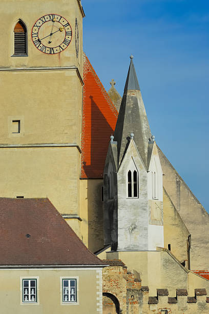 Historic church of Weissenkirchen with blue sky and clouds