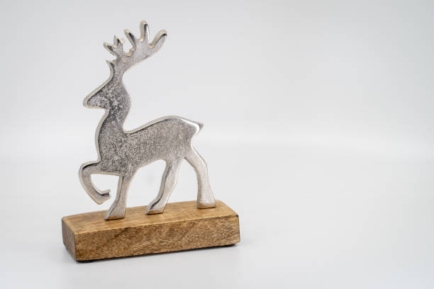 istock Decorative metal christmas reindeer on wood 1451515532