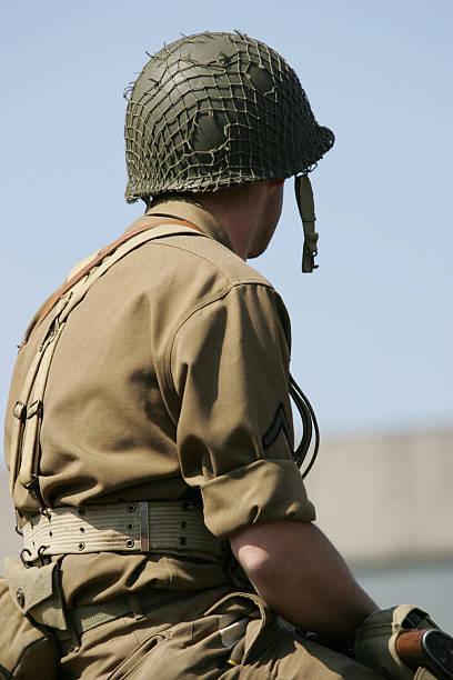 istock One lone soldier sitting at the beach  145152051