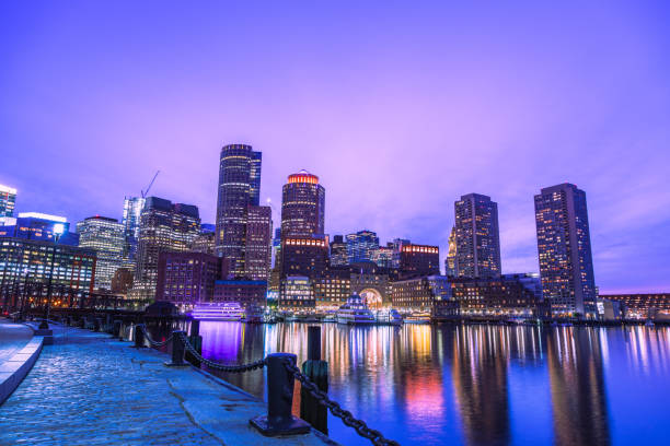 Boston Waterfront at Dusk The beautiful and stunning Boston Waterfront shot at dusk. boston skyline night skyscraper stock pictures, royalty-free photos & images