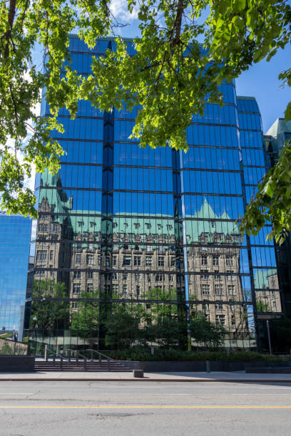 Glass face with reflections of tower of luxury hotel Marriott at Swiss City of Zürich on a sunny hot summer day. Photo taken July 20th, 2023, Zurich, Switzerland.