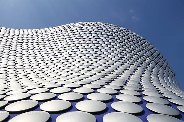 Modern Architecture Detail of modern building with metallic disks bullring stock pictures, royalty-free photos & images