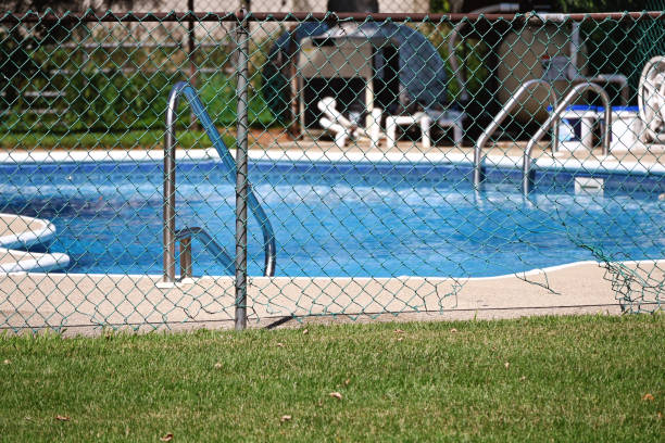 istock Hole in Fence to the Pool 1451523198