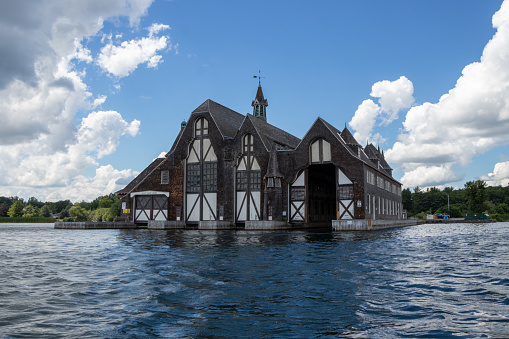 Wellesley Island, NY, United States - August 11, 2022: The George C. Boldt Yacht House was built in 1903 to house the many watercraft of the owner of Boldt Castle.