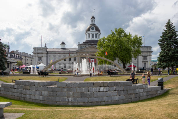 Confederation Park Kingston, Ontario, Canada - July 8, 2022: People on a summer day in Confederation Park. Across the street is the historic city hall building. kingston ontario photos stock pictures, royalty-free photos & images