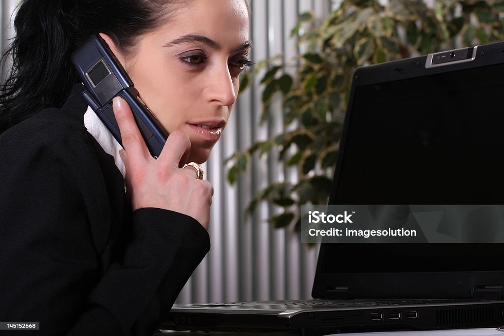 business women answering the phone pretty business women answering the phone Adult Stock Photo