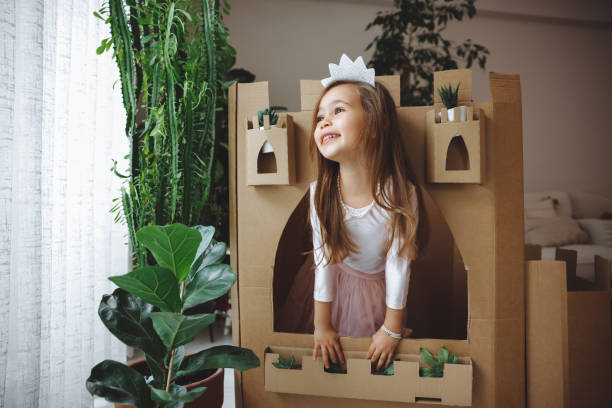 istock Little girl playing with handmade castle 1451526935