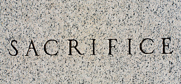 istock Word "Sacrifice" Carved in Gray Granite 145152702