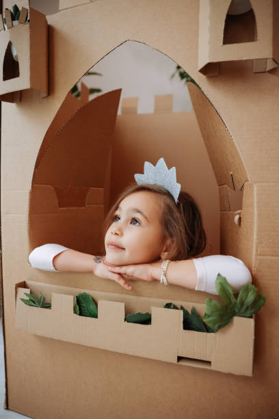 istock Little girl playing with handmade castle 1451528554