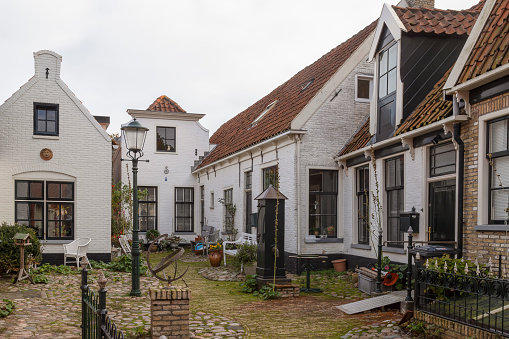 Courtyard with water pump in the center of the village of Den Burg on Texel.