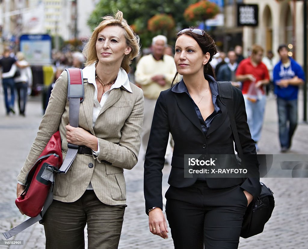 Two women Two women walking at shoppingstreet Adult Stock Photo