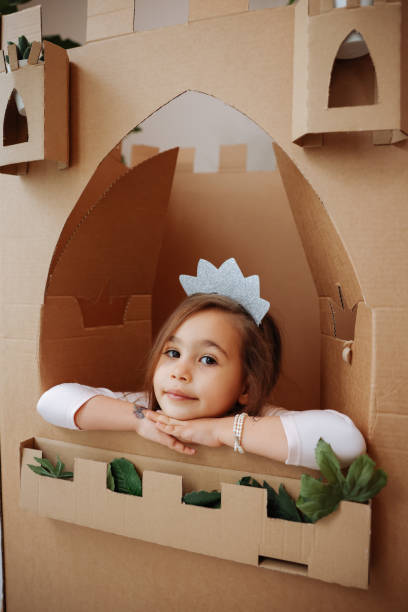 istock Little girl playing with handmade castle 1451529284
