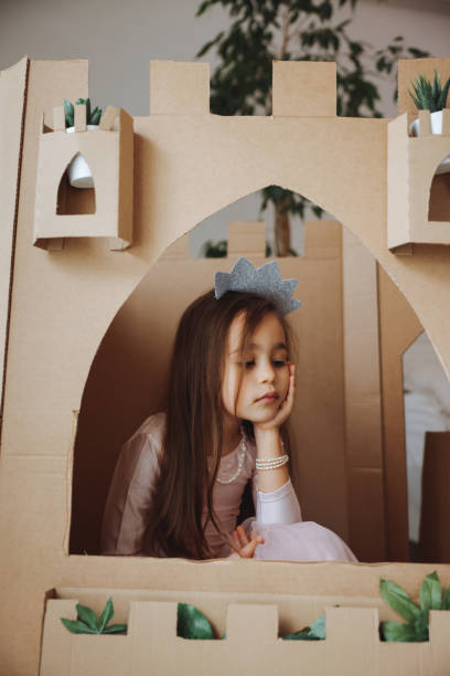 istock Little girl playing with handmade castle 1451530973