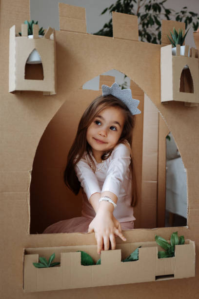 istock Little girl playing with handmade castle 1451532102