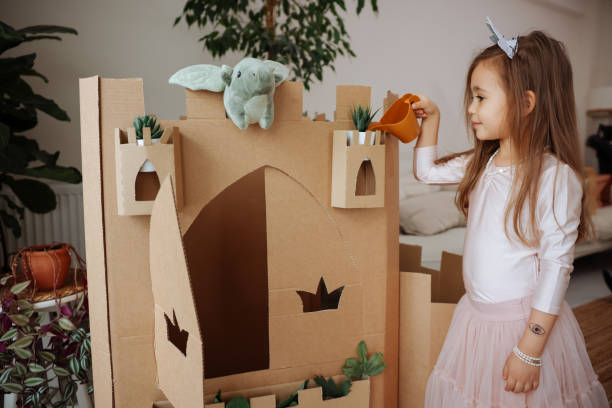istock Little girl playing with handmade castle 1451533119