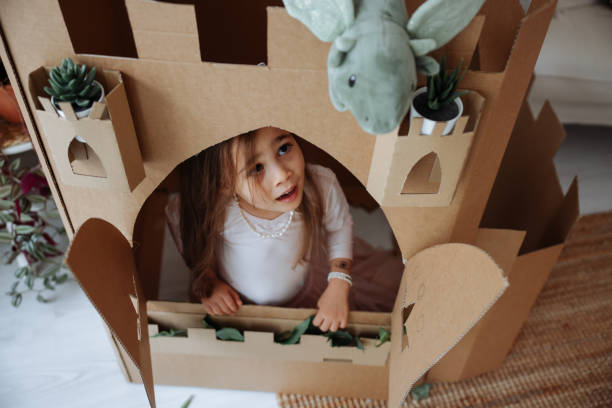 istock Little girl playing with handmade castle 1451534600