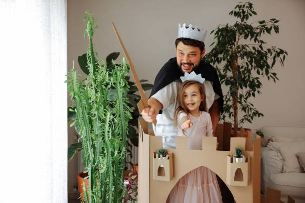 istock Father Playing Exciting Adventure Game With Daughter 1451536526