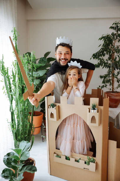 istock Father Playing Exciting Adventure Game With Daughter 1451537087