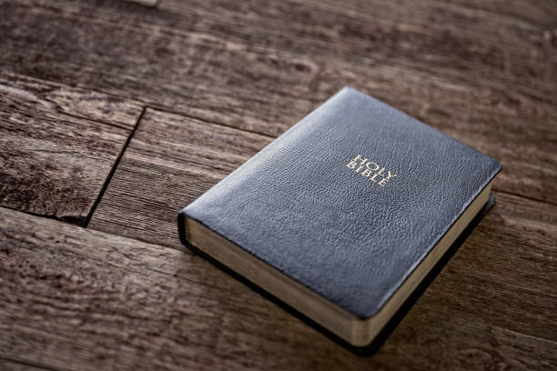 istock Bible on Retro Wood Background 1451537248