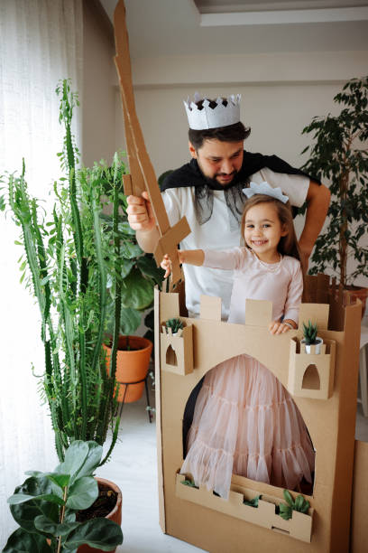 istock Father Playing Exciting Adventure Game With Daughter 1451537295