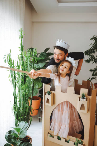 istock Father Playing Exciting Adventure Game With Daughter 1451537410