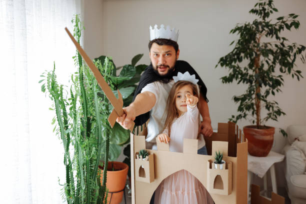 istock Father Playing Exciting Adventure Game With Daughter 1451538095