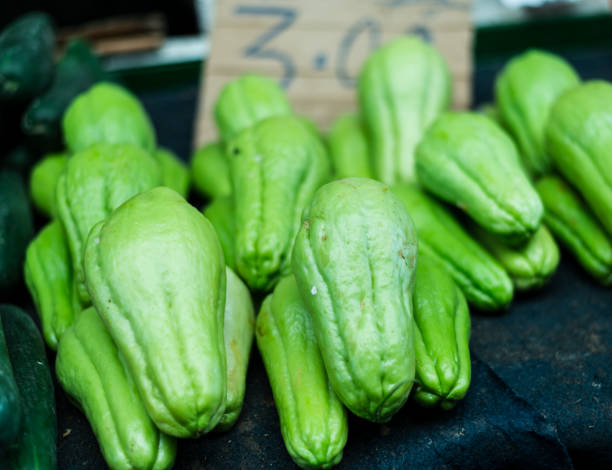 istock Green chayotes stacked and ready for sale. 1451538318