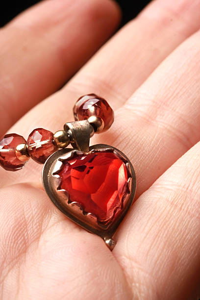 istock heart necklace in hand 145153855