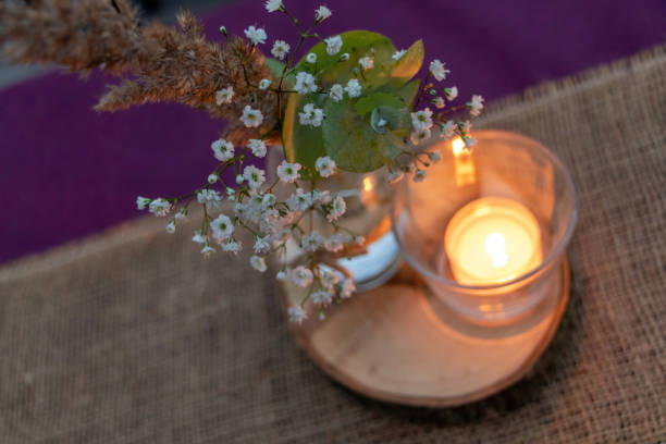 istock Wedding or festive event, candle decoration with flowers on table 1451538679