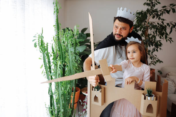 istock Father Playing Exciting Adventure Game With Daughter 1451538692