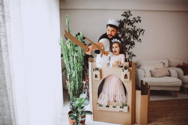 istock Father Playing Exciting Adventure Game With Daughter 1451538764