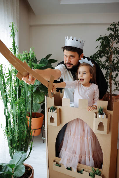 istock Father Playing Exciting Adventure Game With Daughter 1451539041