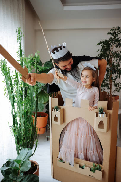 istock Father Playing Exciting Adventure Game With Daughter 1451539090