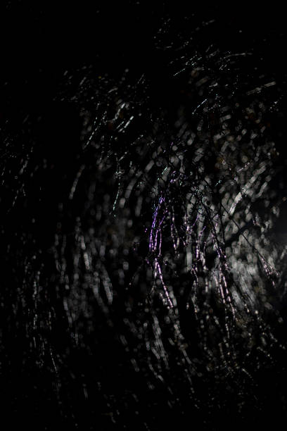 istock Icy tree branches on black background. Ice on branches at night. Dark texture. 1451539817
