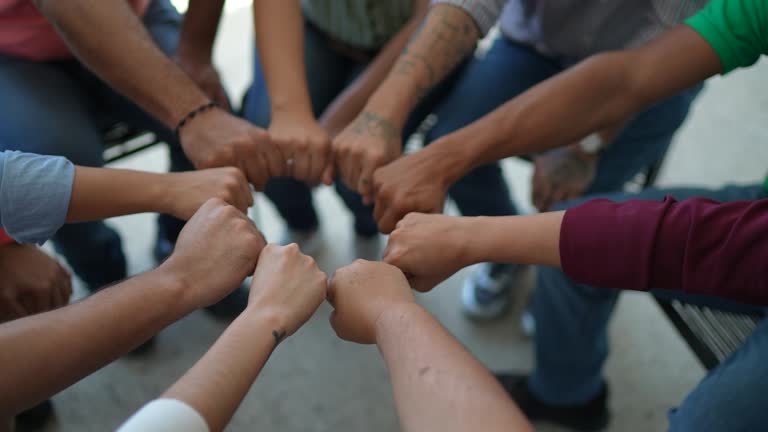 Close-up of a team doing fist bump