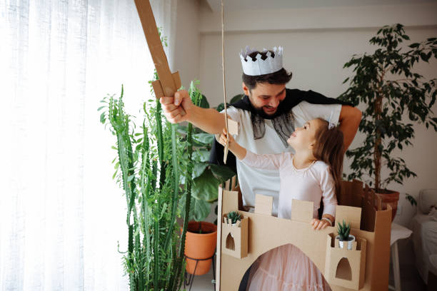 istock Father Playing Exciting Adventure Game With Daughter 1451540535
