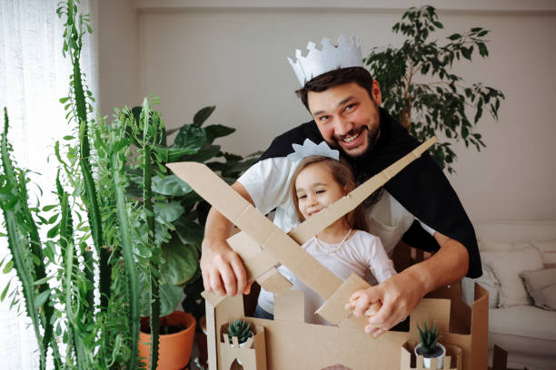 istock Father Playing Exciting Adventure Game With Daughter 1451540836