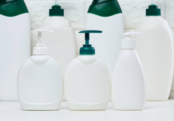 istock White plastic container with a pump for liquid products on a white shelf. Container for cosmetics 1451541113