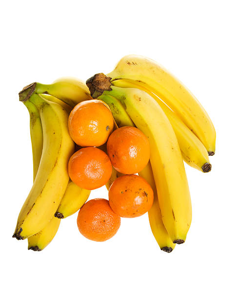 Bananas e Laranjas (isolado - fotografia de stock