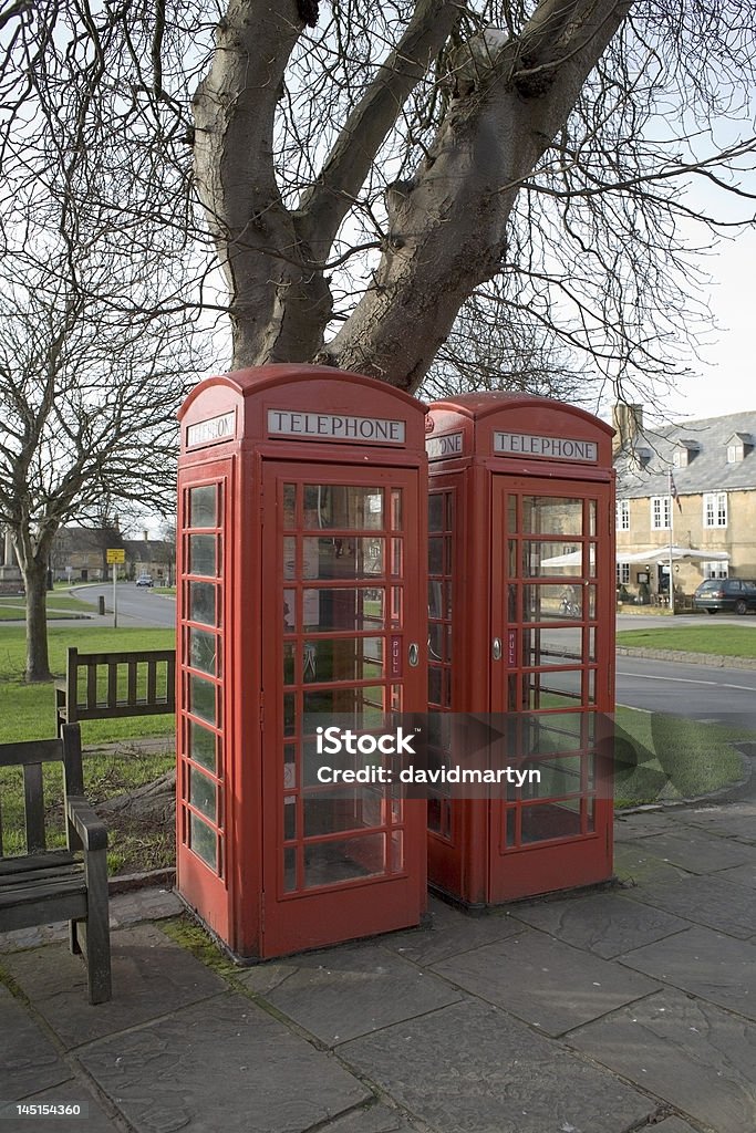 telephone box Two red telephone boxes in an english village. Accessibility Stock Photo