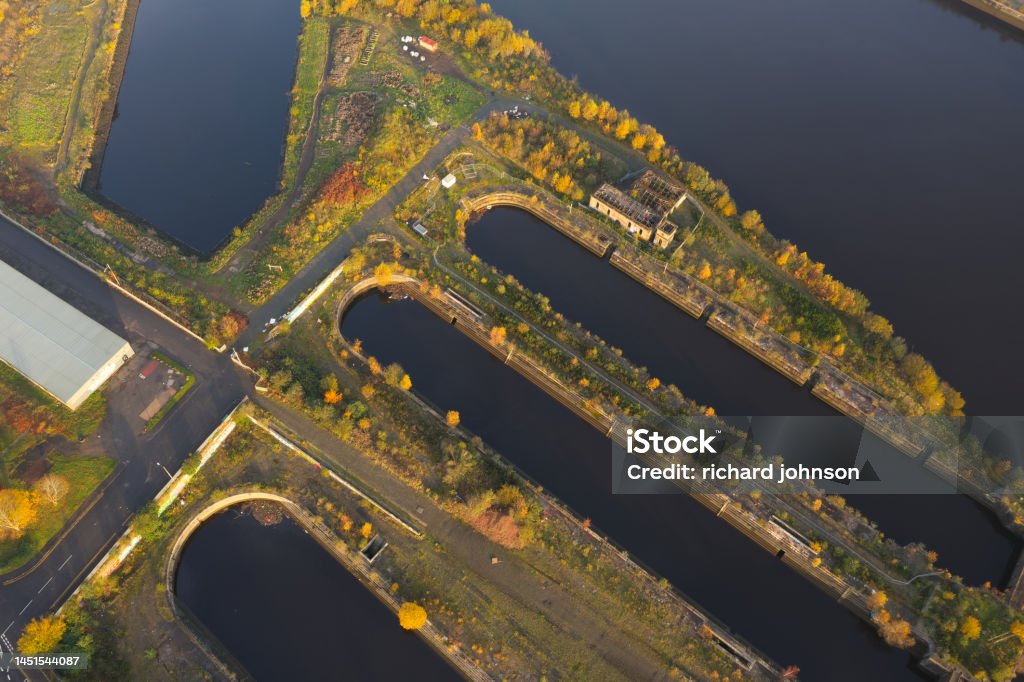 Dry docks now redundant and wetlands area on the River Clyde Dry docks now redundant and wetlands area on the River Clyde UK Aerial View Stock Photo
