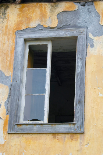 close-up of old decayed window in need of new paint