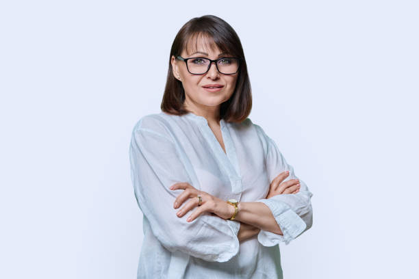 istock Positive middle aged woman looking at camera on white studio background 1451553547