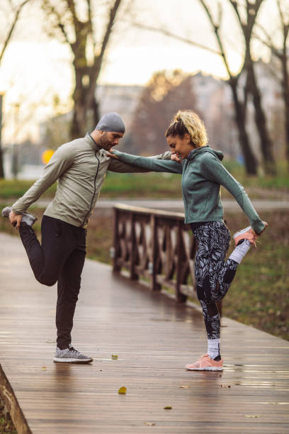 istock Man and woman exercising in nature 1451553754