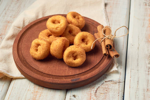 istock Cinnamon sugar mini donuts on a wooden table 1451558166