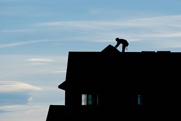 istock Silhouette of Roofer with Blue Sky 145156163