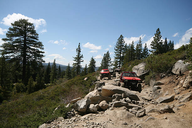 istock Four Wheel Drive trucks on rugged mountain road 145156314