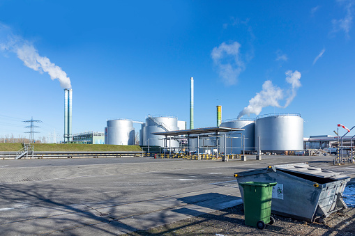 Mainz, Germany - February 13, 2021: industry area with silos and tanks at the rhine harbor in Mainz-Mombach, Germany.